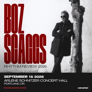Black-and-white image of a man (Bozz Scaggs) in sunglasses and a coat leaning against a tree. Bold red text reads "Boz Scaggs Rhythm Review 2026." Concert details are below.