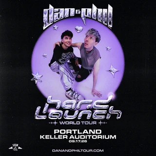 Promotional image for "Dan and Phil Hard Launch World Tour" featuring Dan and Phil in futuristic attire, set against a purple background with stars. Date: 09.17.26, Portland/Keller Auditorium.