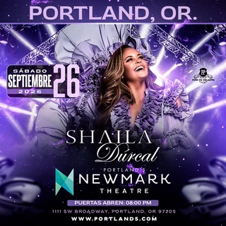 A woman in an elaborate purple dress smiles joyfully, surrounded by vibrant concert lights and stage rigging. The text reads "Shaila Dúrcal" in elegant font.