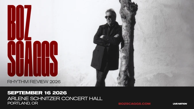 Black and white photo of a man (Boz Scaggs) leaning against a tree, wearing sunglasses and a coat. Red text reads "Boz Scaggs Rhythm Review 2026".