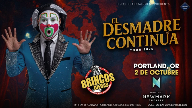 Brincos Dieras with clown makeup and a sparkly blue suit gestures excitedly.