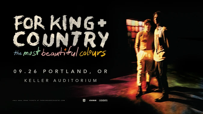 Promotional image "for King & Country: The Most Beautiful Colours" Tour featuring two people (Joel and Luke Smallbone of for KING + COUNTRY) standing against a colorful, illuminated background.