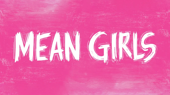 Bold white brushstroke text on a bright pink textured background reads "Mean Girls." The tone is vibrant and youthful.