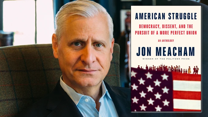 Jon Meacham, an older man with gray hair, sits in a chair with an overlayed image of a book titled "American Struggle" by Jon Meacham. The book cover features an American flag and silhouettes of people.