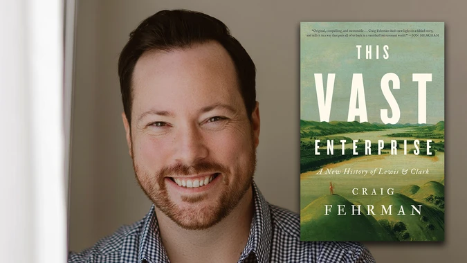 A smiling man (Craig Ferhman) in a checkered shirt is shown next to the cover of his book "This Vast Enterprise," featuring green landscapes and the title prominently displayed.