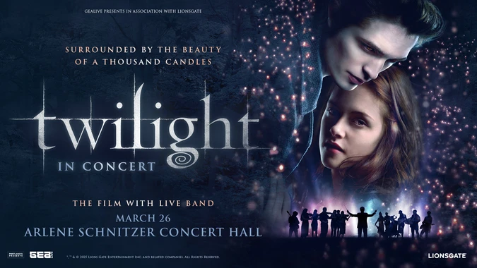 Twilight in Concert image: Edward and Bella embrace amid candlelit sparkles, with orchestra silhouettes below; dark, romantic concert mood.